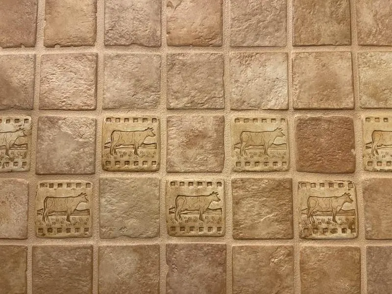Relief-patterned beige square wall tiles