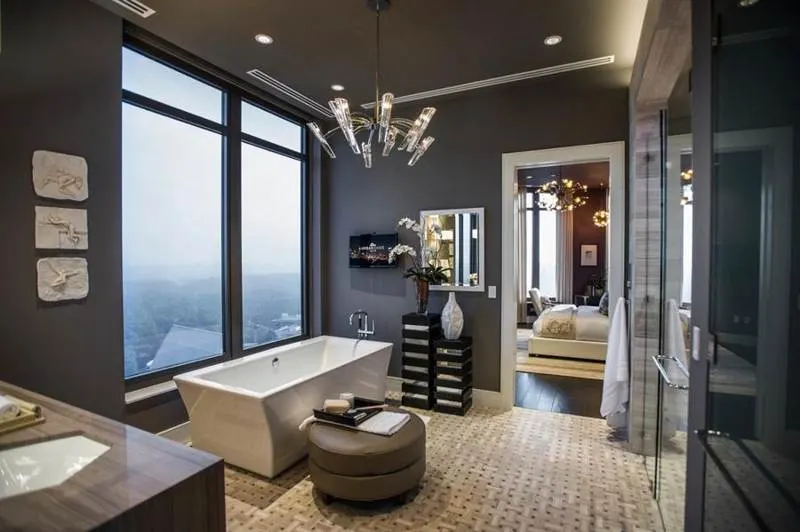 Contemporary bathroom with contrasting pale and dark floor tiles