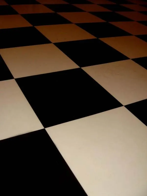 Black and white square floor tiles in a checkerboard pattern
