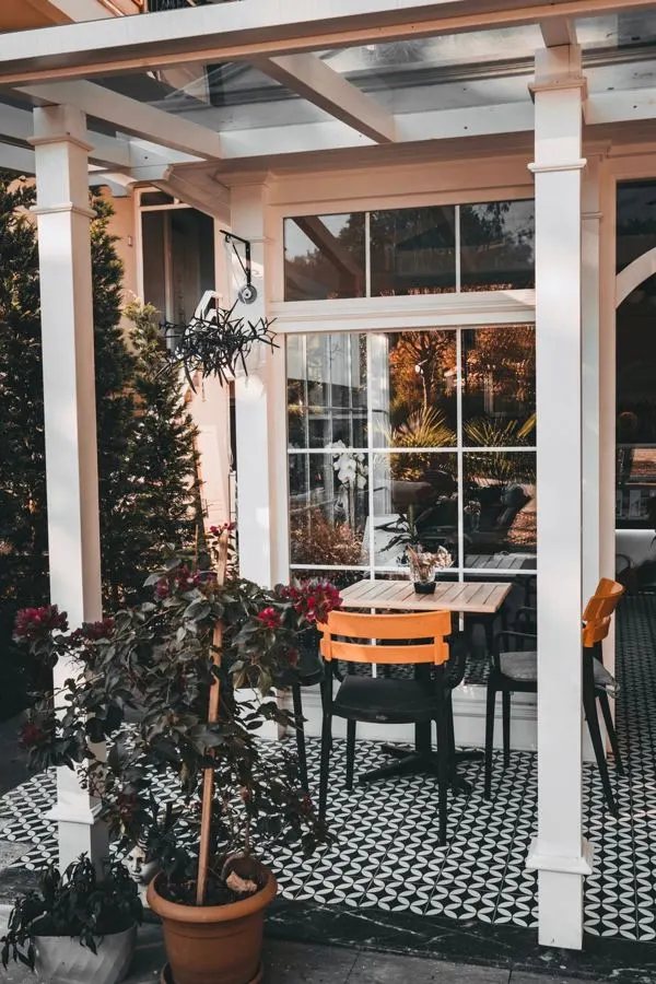 Outdoor seating area with a patterned tiled floor