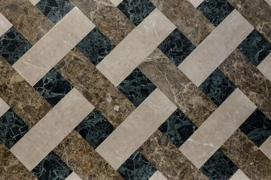 Interlaced geometric floor pattern in pale and dark stone