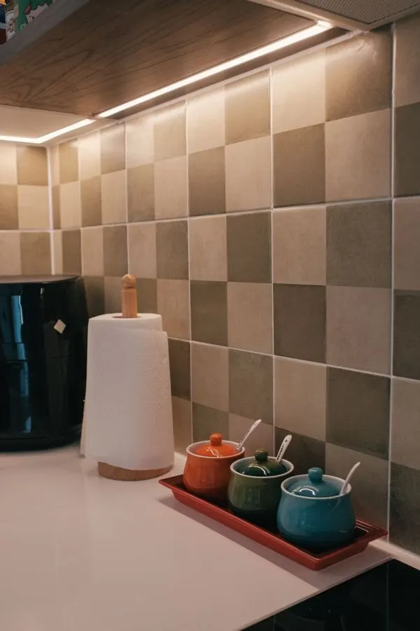 Kitchen backsplash with large beige and brown square tiles