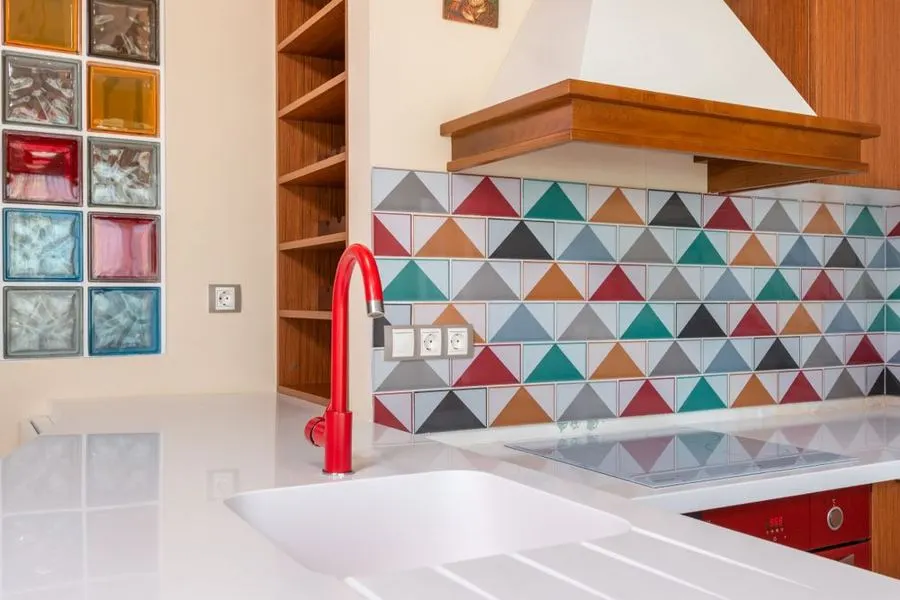 Kitchen backsplash made from colourful triangular tiles